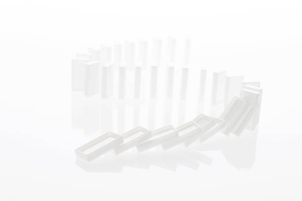 istock A row of white dominos falling down 957623828