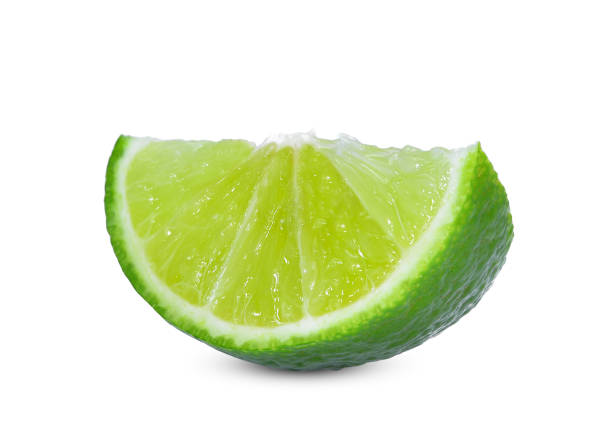 istock sliced fresh green lime isolated on white background 957625392