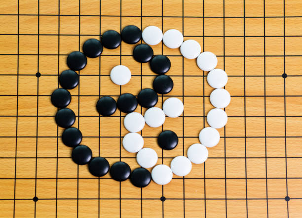 istock Yin yang symbol on go game board 957629016
