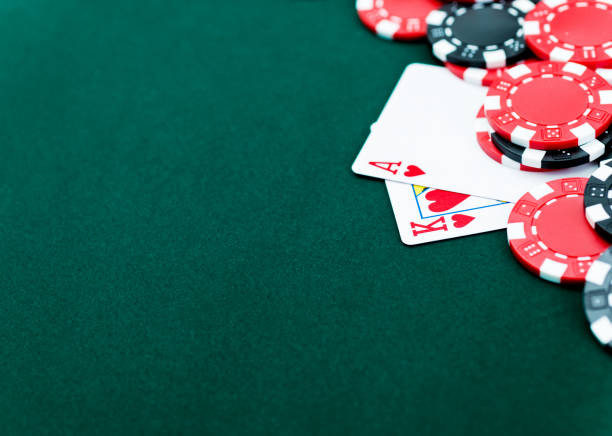 istock Ace and king of hearts with poker chips 957629450