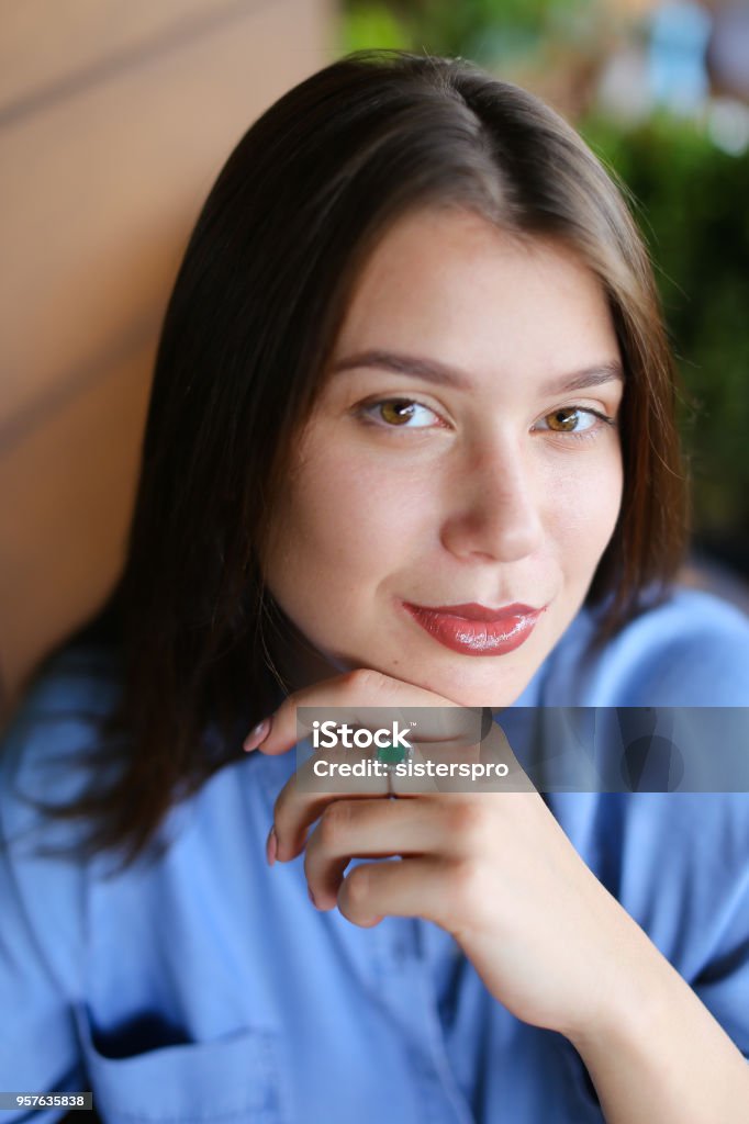 Close up portrait of beautiful woman with everyday makeup Close up portrait of pretty girl with everyday makeup and wearing jeans shirt. Concept of beauty and appearance. Adult Stock Photo