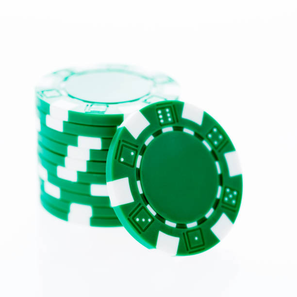 istock A stack of green poker chips on white background 957638226