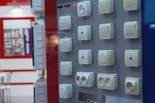 Electrical household switches on the stand in the store. Sale