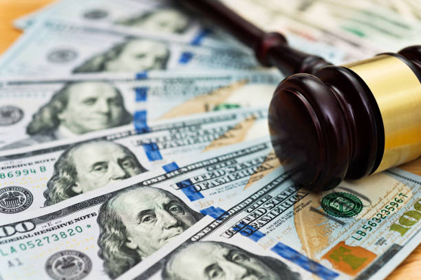 American one hundred dollar bills and gavel American one hundred dollar bills and gavel. gavel photos stock pictures, royalty-free photos & images