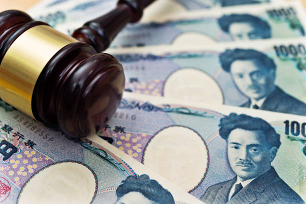 istock Group of japanese yen and gavel 957642386
