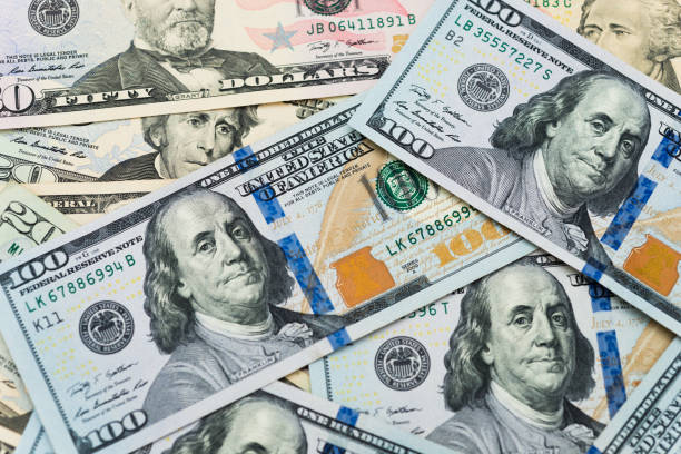 istock Group of dollar bills background 957642446