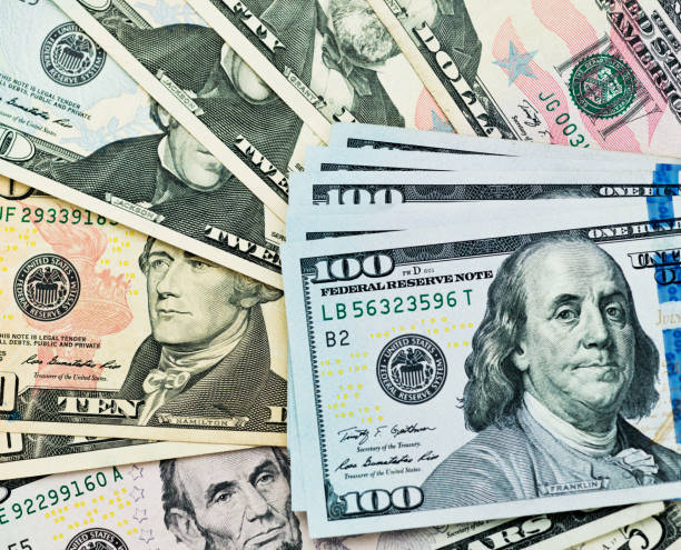 istock Group of dollar bills background 957642622