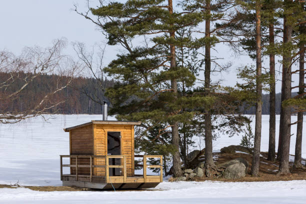 little sauna, sweatbath, near a typical swedish lake, tradional scandinavian folkway - finland sauna lake house imagens e fotografias de stock