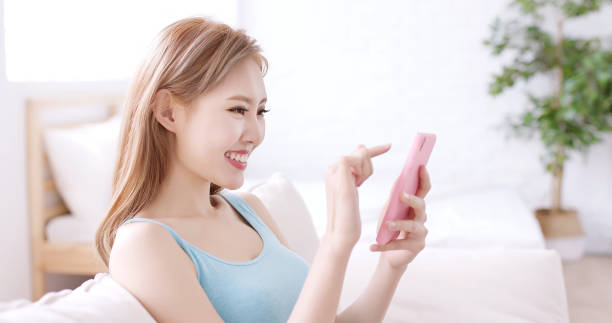 istock woman use phone 957654632