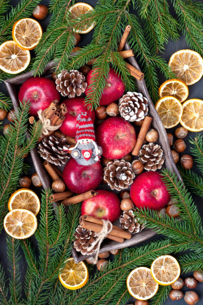 istock Christmas fruits on wooden background 957655574