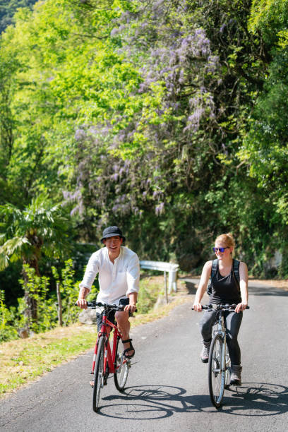 istock Young couple cycling in the mountains 957655634