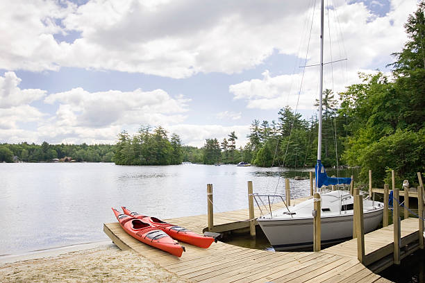 Pine Lake, USA - August 11, 2024: Tourists enjoy watercrafts on the lake on a summer day
