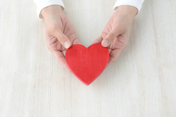 istock Heart being had by female hands 957669576