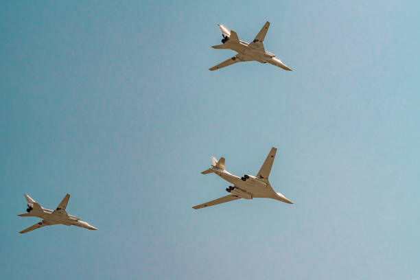 Tupoloev Tu-160 and Tupolev Tu-22M-3 strategic bombers of Russian Air Force during Victory Day parade rehearsal. Moscow, Russia - May 04, 2018: Tupoloev Tu-160 and Tupolev Tu-22M-3 strategic bombers of Russian Air Force during Victory Day parade rehearsal. tu160 stock pictures, royalty-free photos & images