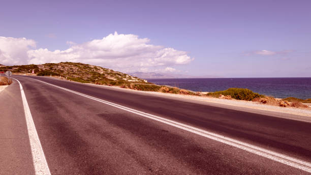 istock Deserted highway along the sea, travel concept. 957670672