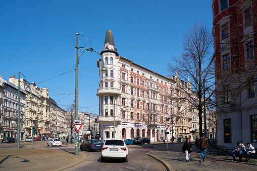 Magdeburg, Germany – April 08, 2018: Road traffic and historic buildings on Hasselbachplatz in the center of the city of Magdeburg