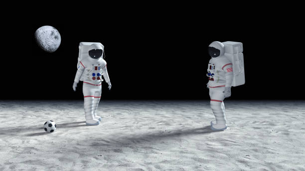 istock Two Astronauts Playing Soccer On The Alien Planet Surface - Made Up Logo On Suit 957683744