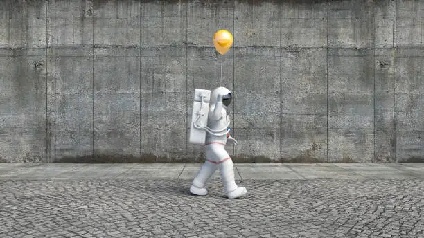 Photo of An Astronaut Walking On A City Sidewalk Holding A Balloon