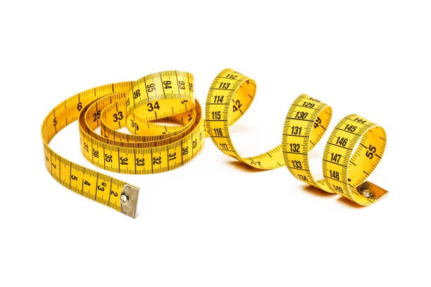 istock Tape measure isolated on white 957685044