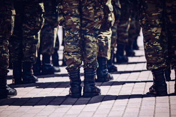 istock Soldiers in masking camouflage uniforms on parade 957685266