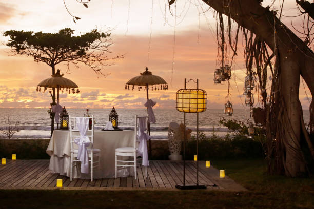 Beautiful romantic dinner set up, sunset time, tropical style
