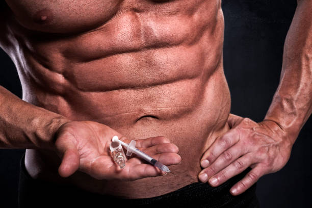 male fitness athlete with steroids - shooting up imagens e fotografias de stock