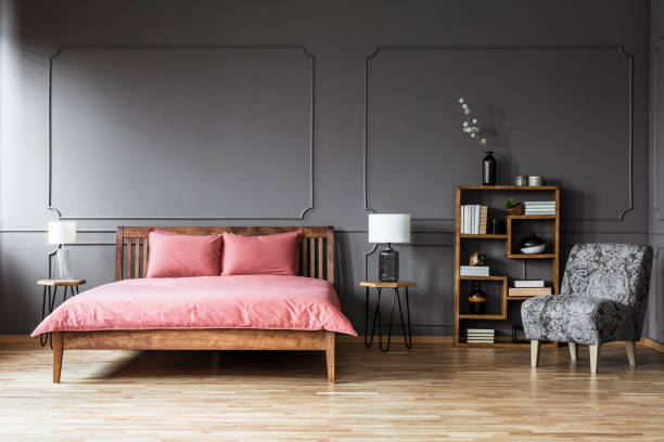 istock Grey and pink bedroom interior 957694182