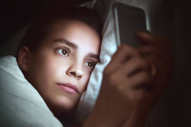 istock Woman in bed with smartphone 957694206