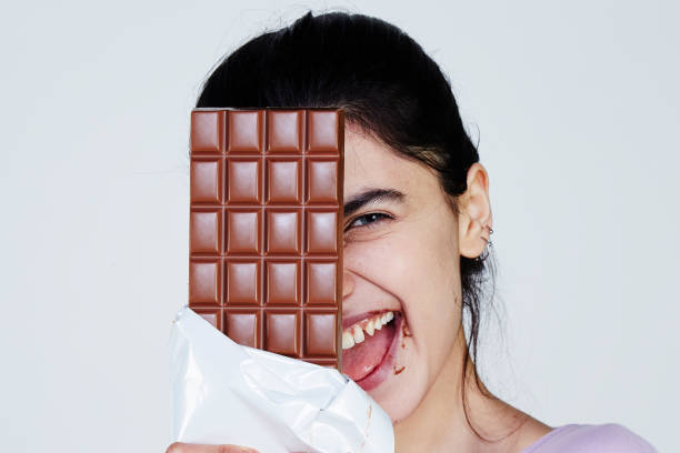 istock Young Woman holding chocolate 957694858