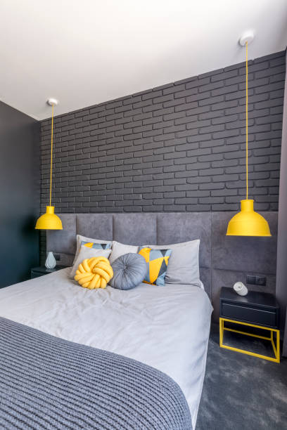 istock Grey and yellow bedroom interior 957696978