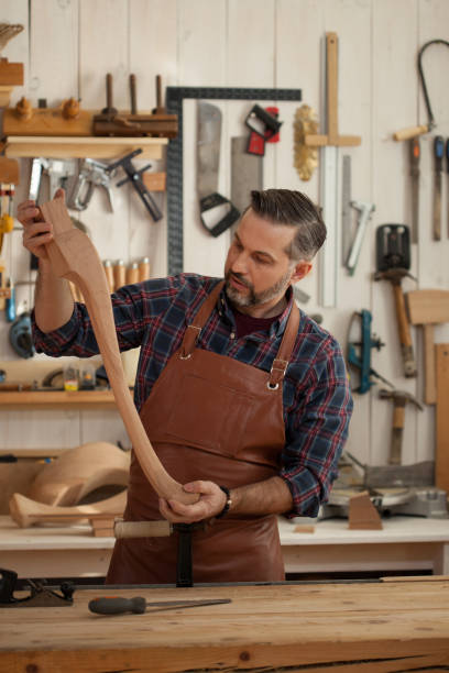 istock Joiner Makes Cabriole Leg for Vintage Table 957697126
