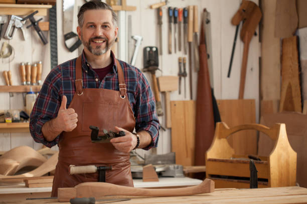 istock Joiner Makes Cabriole Leg for Vintage Table 957697130