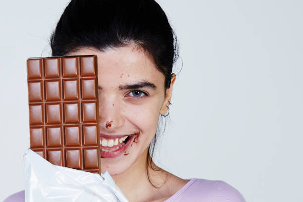 istock Young Woman holding chocolate 957697794