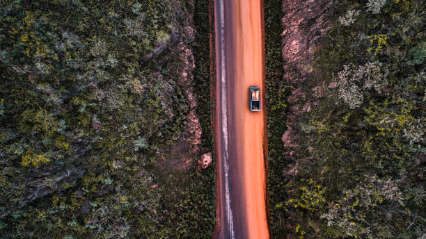 istock country muddy road in mountain view from aerial 957698148