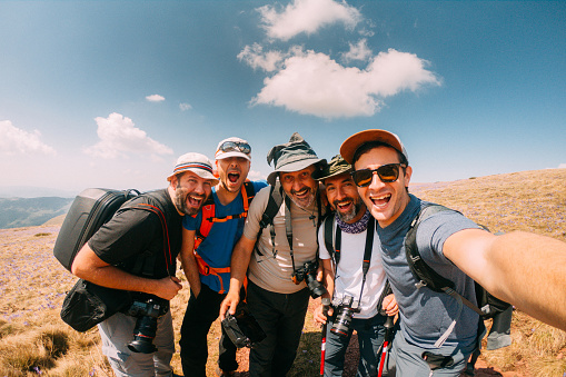 Self portrait of a group of hikers/ photographers during their hike on the mountain peak Midzor