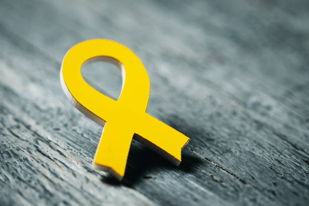 yellow ribbon on a wooden surface