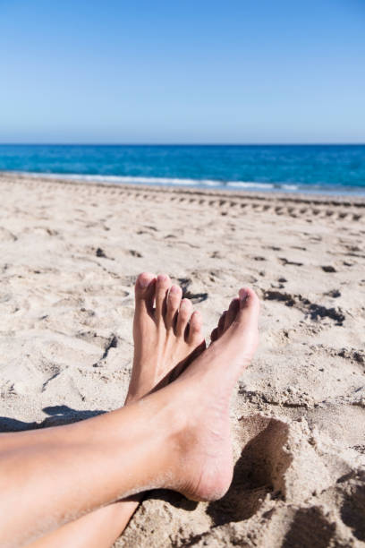 istock young man relaxing on the beach 957703708