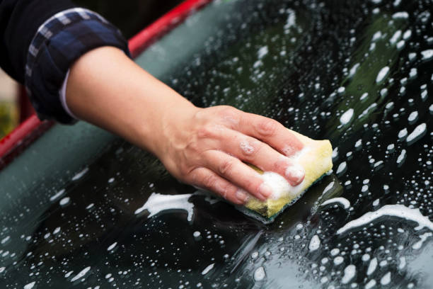 istock young woman washing a car 957703716
