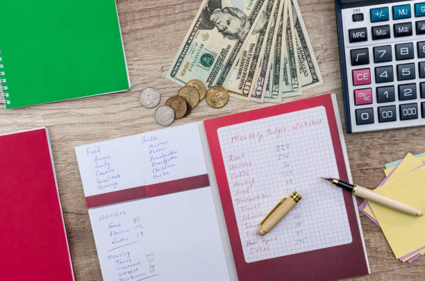 'Monthly budget planning' concept on wooden table