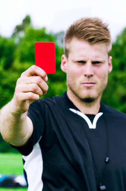 istock Sports referee shows red card after blowing his whistle 957708152