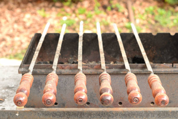 Simple photo background image of metall roaster for shish-kebab