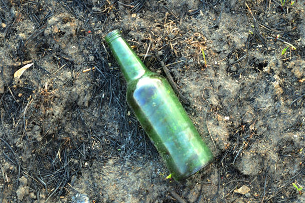istock Abstract image look for designers with melted glass after wildfire on black dirt 957727942
