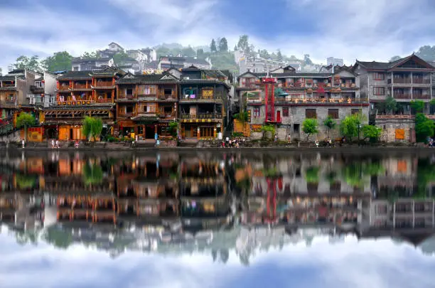 HUNAN, CHINA - JUNE 16, 2014 : Old houses in Fenghuang county in Hunan, China. The ancient town of Fenghuang was added to the UNESCO World Heritage Tentative List in the Cultural category.