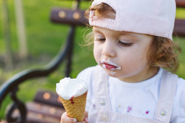 istock girl eating ice cream 957745410