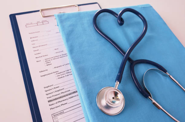 istock A stethoscope shaping a heart on a medical uniform, closeup, selective focus 957745510