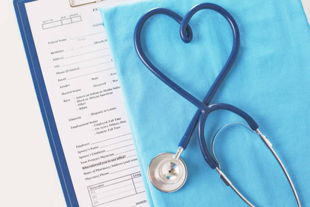 istock A stethoscope shaping a heart on a medical uniform, closeup, selective focus 957745658
