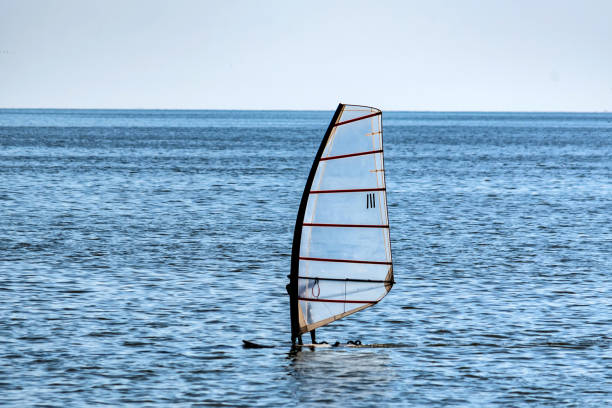 istock Lonely windsurfer in the sea 957748322