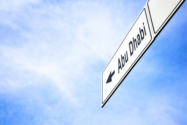 istock Signboard pointing towards Abu Dhabi 957749328