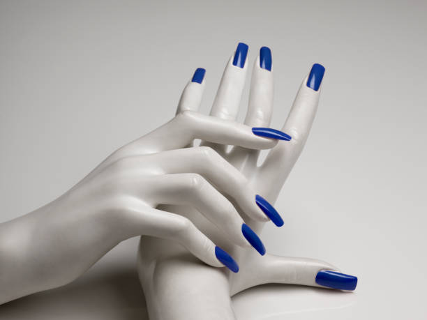 mannequin hands with perfect manicure and blue nail polish