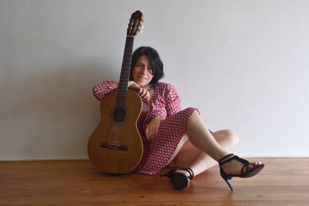 istock Woman with guitar 957750106